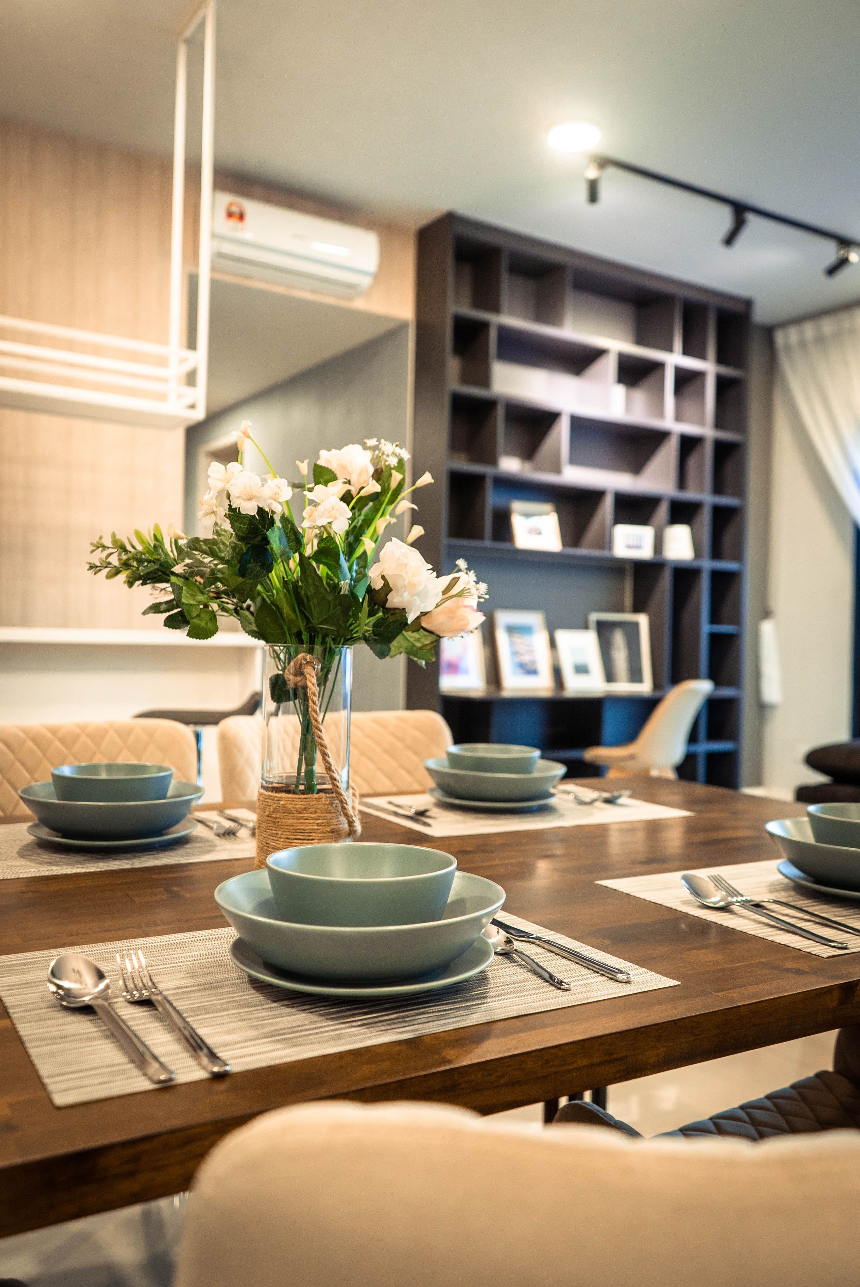 Guest-ready dining table styled with fresh flowers in a serviced accommodation property